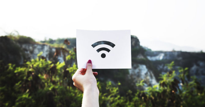 hand holding wifi icon