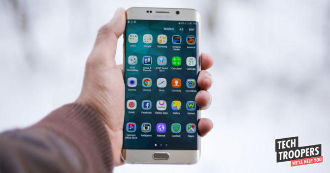 Hand holding a Samsung smartphone