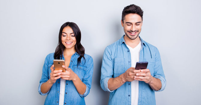Happy-man-women-smart-phones-in-hands-looking-at-smartphone-blog.jpg